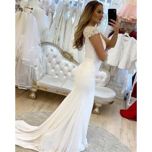 New Simple Mermaid Wedding Dresses Deep V-Neck Lace Cap Sleeves Bridal Gowns Hollow Back Button Sweep Train Wedding Gowns