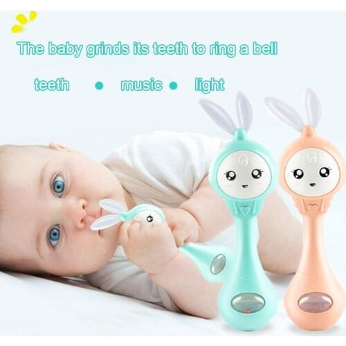 Cartoon Rabbit Baby Shaking Rattle Hand Bell with Music Light Teether Toy Gift attract babys attention grinding their teeth