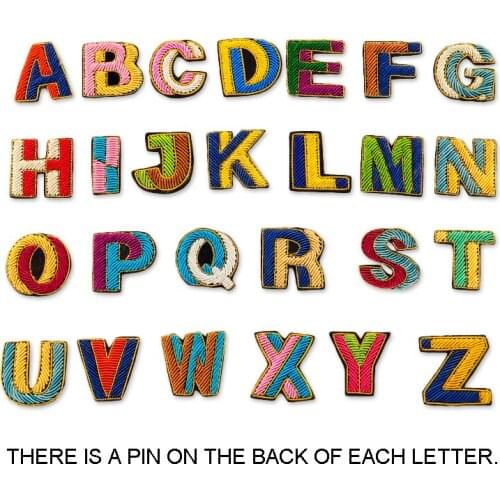 26 letter Embroidered Patches Pure hand-embroidered with metal spring copper wire badges There is a pin on the back