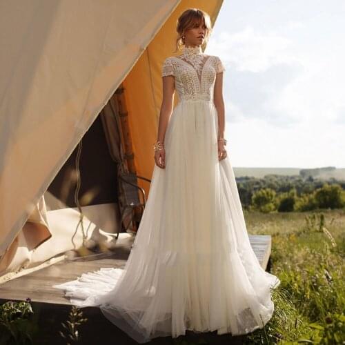 Boho Lace Wedding Dresses 2021 Short Sleeves High Neck Cut-out Back Beach Bride Dresses Buttoned A-Line Bohemian Wedding Gowns