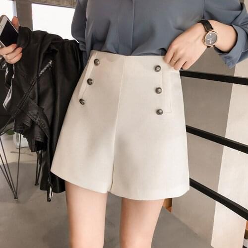 The new double-breasted womens fashion casual loose significant lanky waist wide leg shorts solid color