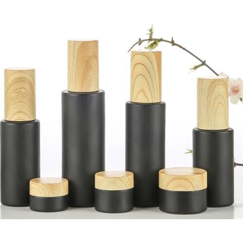 Black Frosted Glass Cosmetics Container With Wooden Cap , Cream Jars Lotion Cream Bottles ,Perfume Sprayer Container Tin Glass