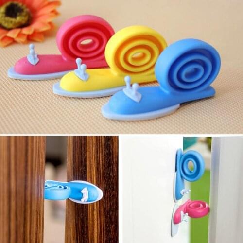 3Pcs/lot Soft Plastic Baby Home Safety Door Stopper Protector Children Safe Snail Shape Door Stops Baby gate corner protector