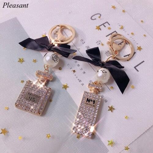 New Creative Crystal Perfume Bottle Key Chain Fashion Pearl Bow Bag Key Chain Car Pendant Lady Jewelry Gift