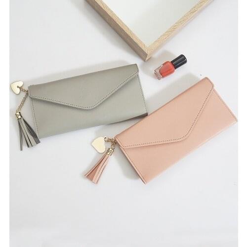 2020 new wallet female long tide Korean students wallet fashion simple love tassel buckle wallet