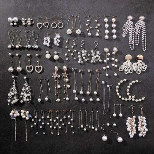 New hollow long heart-shaped pendant earrings Sweet simulated pearl geometric tassel earrings Brinco womens fashion jewelry