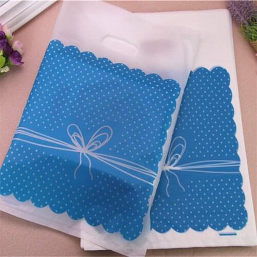 2021 New Design Wholesale 100pcs/lot 25*35cm Large Plastic Christmas Packaging With Bow Birthday Gift Packing Bags