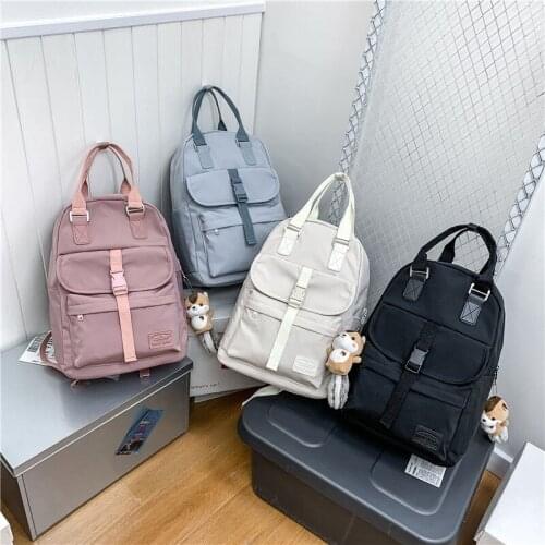 Fashion Women Backpack Nylon Waterproof Schoolbag For Girls Cute Doll Pendant Solid Color Travel Backpack 2021 Mochila
