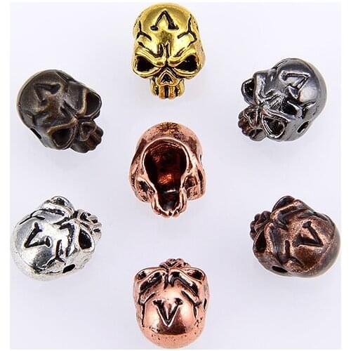 10PCS / zinc alloy material skull perforated beads specification length 12mm width 9mm hole 1.5mm can be equipped with DIY bead