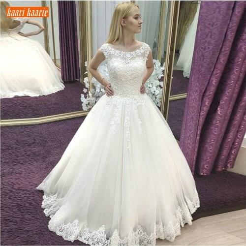 Elegant Tulle White Wedding Dress Sleeveless Princess Ball Gown Bridal Dresses Long Appliques Lace Up Chapel Ivory Wedding Gowns