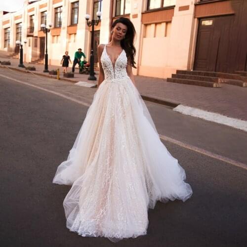 Spaghetti Straps Crystals A-line Elegant Tulle/Lace Champagne Wedding Dress Bling Bling Sequin Open Back Bridal Dress