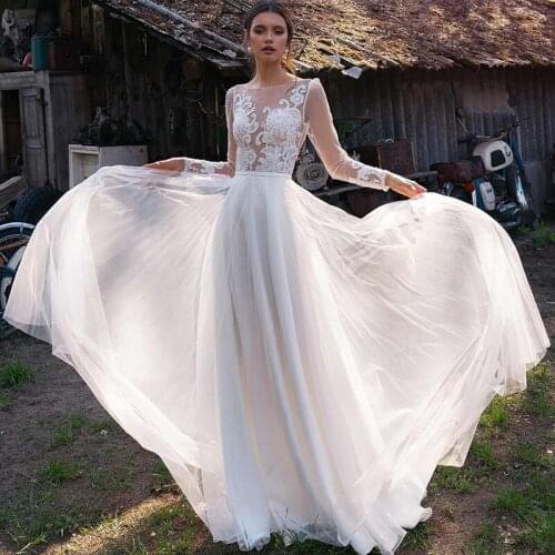 Elegant A-Line Long Sleeve Wedding Dresses 2021 O-Neck Lace Appliques Sexy Backless Tulle Floor Length White Bridal Gown