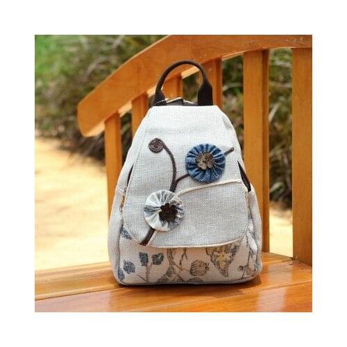 Fashion national string appliques woem shopping backpacks!Nice floral embossing lady canvas backrack All-match canvas backruck