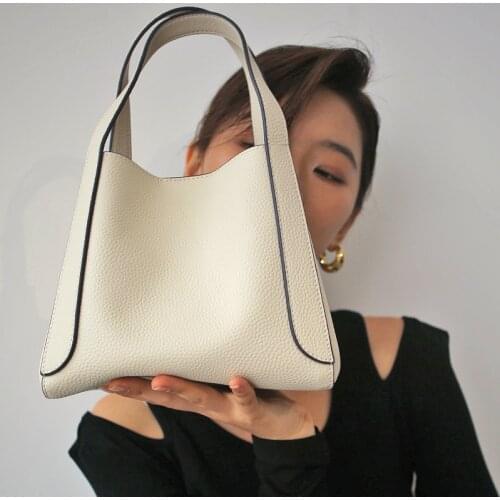 Fashion, leisure, light and versatile one-shoulder messenger portable first layer cowhide large capacity commuter bucket bag