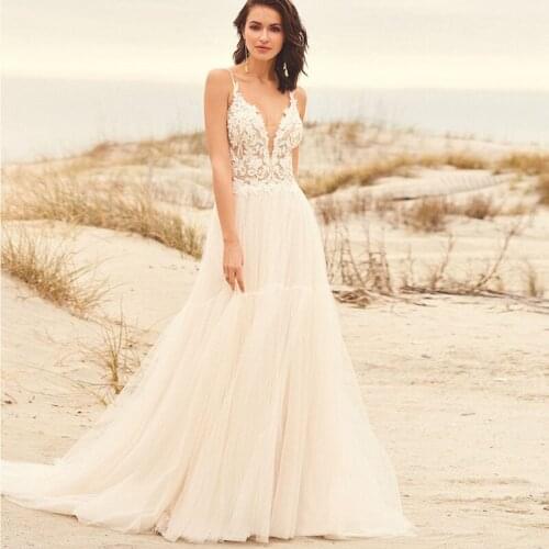 Popular Beach Lace Wedding Dresses Spaghetti Straps Appliques Lace A-Line White Bride Dress Princess Wedding Gown Backless 2021