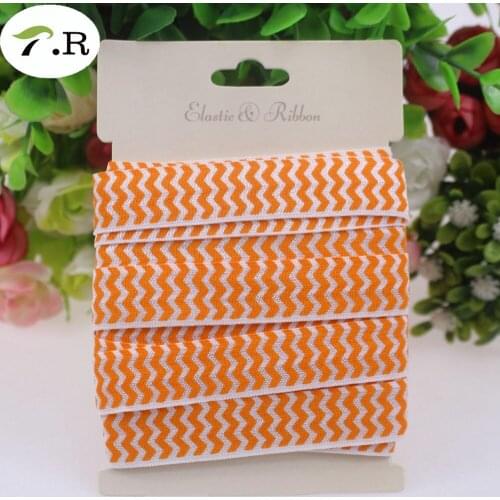 5/8" fold over elastic 668 orange chevron on 029 white foe elastic 10yards/lot without card