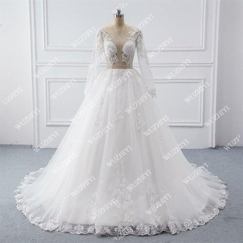 WUZHIYI Illusion Tulle Princess Ball Gown Wedding Dresses For Women Long Sleeves Lace Appliques Beaded Bridal Gowns Plus Size