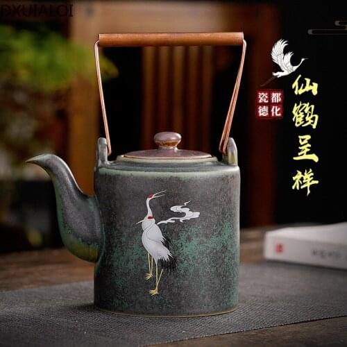 Kiln turned into a crane Chengxiang, ceramic retro simple teapot, stoneware copper handle, soaked teapot, home decoration