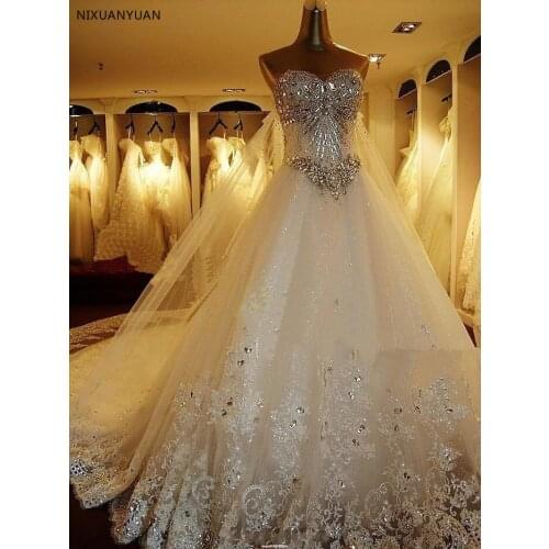 NIXUANYUAN Wholesale Luxury Big Train Wedding Dress Sexy Crystals Beaded Bridal Gown Custom Made Plus Size Wedding Gown