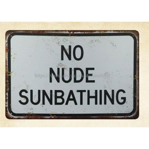 Interior collectible No Nude Sunbathing metal tin sign