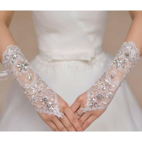 A pair white Wedding Bridal pearl wedding floral lace gloves