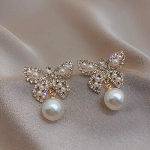 925 Silver Needle Korean Version Rhinestone Pearl Earrings Bow Personality Retro Ear Studs