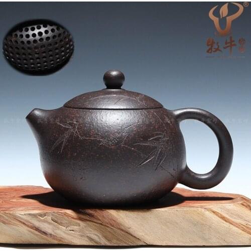 The supply of authentic Yixing ore teapot carving ball hole black cinnabar bamboo fun 200 ml mixed batch pot of beauty