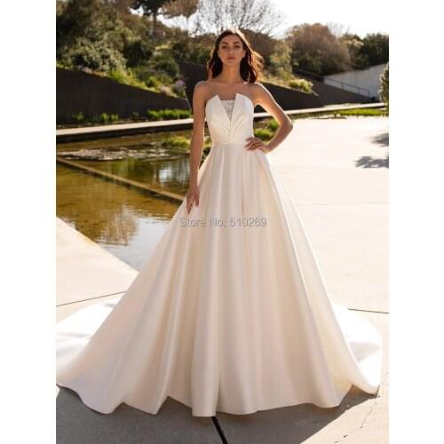 Real Made Ball Gown Wedding Dress Full Skirt Pleated Sleeveless Beaded Satin Bridal Gowns Vestidos Casamento Custom Made Robe De