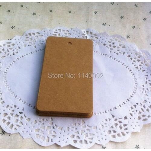 Free shipping 100 pcs a lot wholesales DIY blank kraft paper tag 7x11cm/clothing hang tag/gift packing tag/garment printed tags