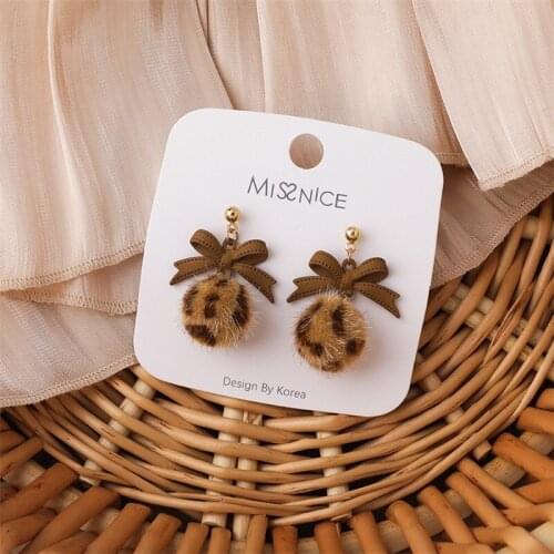 Korean Version Of Autumn And Winter Milk Coffee Color Bow Leopard Hair Ball Personality Earrings Wild Temperament Earrings Women