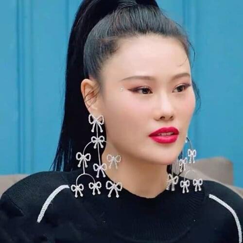 New designer design heavy rhinestone bow tassel long earrings, the temperament of luxury catwalk women jewelry earrings