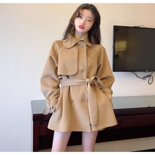 Autumn and winter lady solid color windbreaker coat fashion new temperament British loose belt waist middle long coat woman