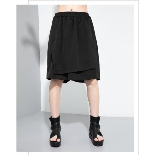 Foreign trade tide brand fake two-piece skirt pants, dark black 2021 summer wear, new personalized splicing wide leg pants, Capr