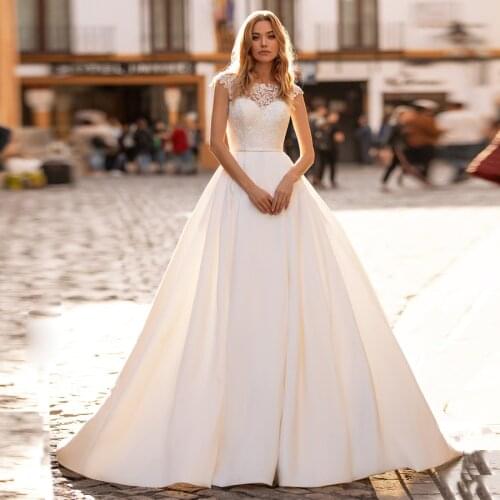 Sexy Satin Ball Gown Wedding Dresses Cap Sleeve Lace Applique Sweep Train Bridal Gown Illusion Back Abiti Da Sposa Wedding Dress