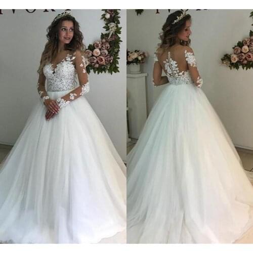Illusion Long Sleeve Wedding Dresses 2021 Modest Lace Applique Beaded Sheer Neck Princess Garden Wedding Gown vestidos de novia
