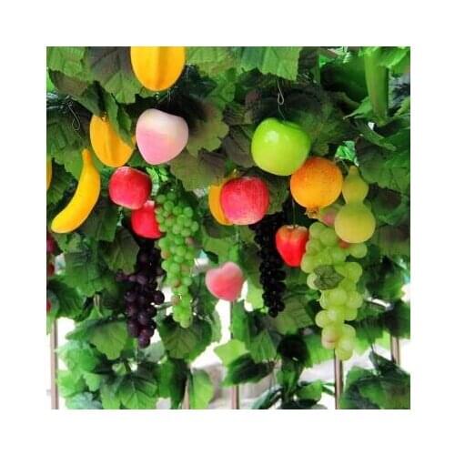 Simulated grape vine with false fruit vine leaves ivy vine conduit green plants and flowers.christmas decorations for home