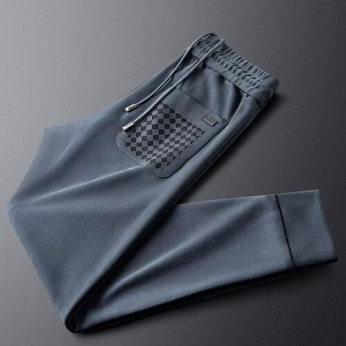 Fashionable back pocket hollow sports casual pants mens autumn soft and slippery fabric mens knitted sweat pants