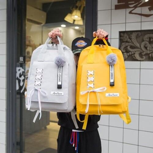 Japanese cute bow fur ball backpack ins super fire drawstring bag Korean version of the wild campus backpack