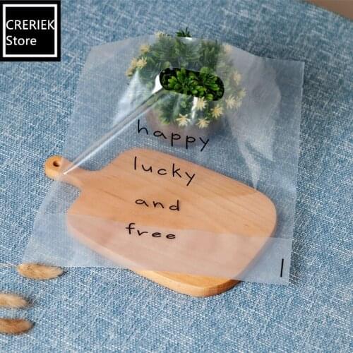 50pcs/lot Plastic Package Bag "happy lucky and free" Gift Bags With Handles Transparent Food Handmade Bakery Packaging Bags