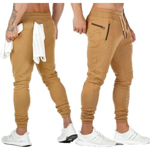 Men Casual Pants Solid Gray Black Gyms Fitness Workout Sportswear Trousers Male Cotton Trackpants Pencil pants Jogger Sweatpants