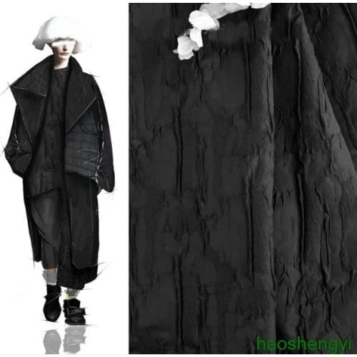 High quality black three-dimensional jacquard texture relief rock bark texture creative new garment fabric / half price