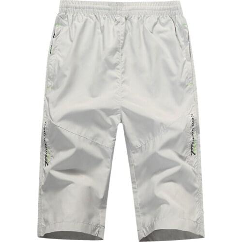 Explosion mens youth loose cropped pants casual micro-elastic quick-drying thin sports shorts