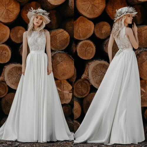 2020 Bohemian Wedding Dresses Jewel Sleeveless Lace Appliques Satin Bridal Gowns Sweep Train Beach Boho A-Line Wedding Dress