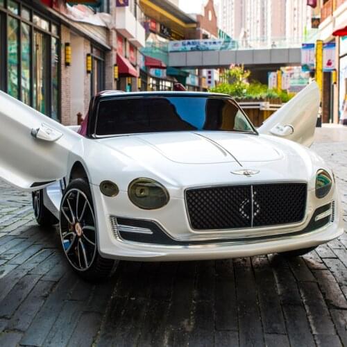 The New Hot Childrens Four-Wheel Toy Electric Car Can Ride With Bluetooth Remote control, Double-Door, Headlight