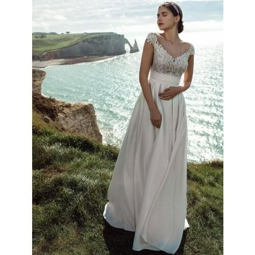 V-Neck Lace Wedding Dress Bohemian Beach Elegant Pearls Closure Pleated Waistband Bridal Gowns Transparent Back Short Train 2021