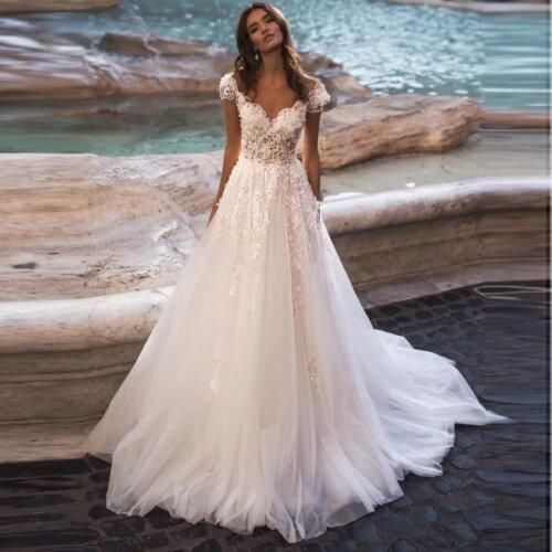 O Neck Wedding Dresses A Line Wedding Gowns Lace Appliques Short Sleeve Bridal Gown Backless Robe De Mariee Floor Length
