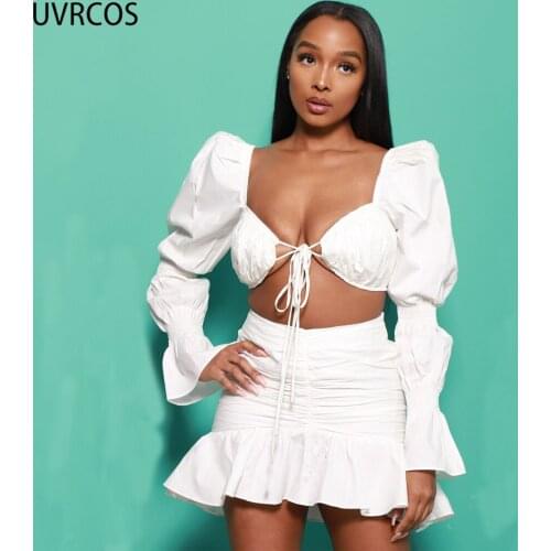 UVRCOS White Skirt Two Piece Set Women Low V Neck Lace Up Cut Out Long Puff Sleeve Tops+Stacked Folds Short Ruffle Short Skirts