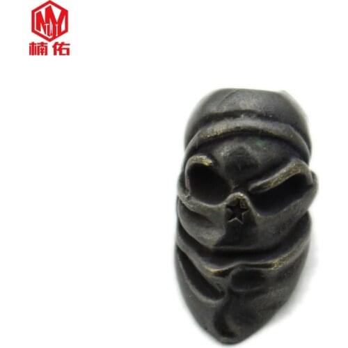 1PCS EDC Keychain Masked Skull Survival Bracelet Paracord Brass Knife Bead Outdoor Backpack Pendant
