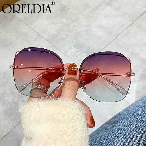 Rimless Sunglasses Men Round Glasses Fashion Trend Gradient Color Rimless Retro Ladies Metal High Quality Sunglasses Hot UV400