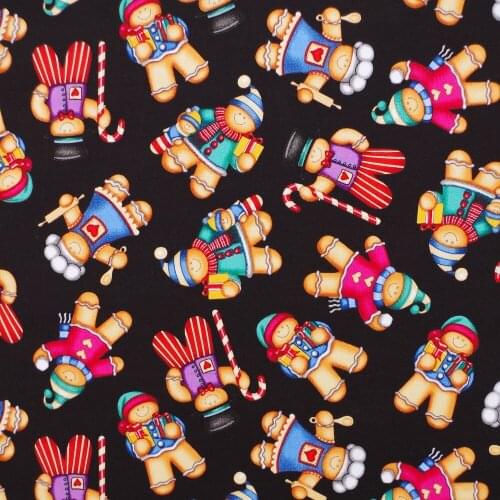 1 yard Cotton Woven Fabric - Gingerbread duties on black background (width=108cm)